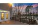 Spacious wood deck with railing and lake view through mature trees at 208 Woodwinds Dr, Mount Holly, NC 28120
