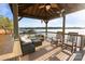 Waterfront gazebo features comfortable seating, ceiling fans, and panoramic views of the lake at 208 Woodwinds Dr, Mount Holly, NC 28120