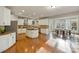 Spacious kitchen with white cabinets, center island, and stainless steel appliances at 208 Woodwinds Dr, Mount Holly, NC 28120