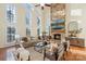 Bright, open living room with stone fireplace and large windows at 208 Woodwinds Dr, Mount Holly, NC 28120