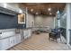 Covered outdoor kitchen with stainless steel appliances and comfortable seating at 208 Woodwinds Dr, Mount Holly, NC 28120
