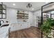 Butler's pantry with white cabinetry, marble countertop and wood-look flooring at 208 Woodwinds Dr, Mount Holly, NC 28120