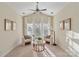 Cozy sitting area with neutral tones, large windows, and comfortable furnishings at 208 Woodwinds Dr, Mount Holly, NC 28120
