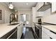 Stylish kitchen with stainless appliances, white cabinets, and sleek countertops at 231 Uptown West Dr, Charlotte, NC 28208