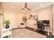 Bright office featuring a ceiling fan, neutral walls, modern artwork, and an elegant rug at 231 Uptown West Dr, Charlotte, NC 28208