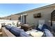 Inviting outdoor patio featuring stylish furniture, a fire pit, and a mounted television at 231 Uptown West Dr, Charlotte, NC 28208