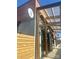 Restaurant's exterior with a covered patio, wooden accents, and natural light at 231 Uptown West Dr, Charlotte, NC 28208
