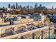 Enjoy city views from this rooftop terrace featuring stylish furniture and open-air space perfect for entertaining and relaxation at 231 Uptown West Dr, Charlotte, NC 28208