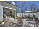 Inviting backyard brick patio, with sitting and dining areas, perfect for outdoor entertaining at 2509 Montrose Ct, Charlotte, NC 28207