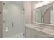 Modern bathroom featuring a glass-enclosed shower and custom vanity at 2509 Montrose Ct, Charlotte, NC 28207
