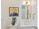 Stylish bathroom featuring modern fixtures, artistic decor, and shiplap walls at 2509 Montrose Ct, Charlotte, NC 28207