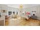Bright bedroom features large windows, a whimsical chandelier, and hardwood floors at 2509 Montrose Ct, Charlotte, NC 28207