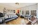 Spacious bedroom with hardwood floors, large windows, and a study area at 2509 Montrose Ct, Charlotte, NC 28207