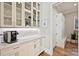 Butler's pantry with custom cabinetry, ample counter space, and a built-in coffee maker at 2509 Montrose Ct, Charlotte, NC 28207