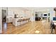 Bright, open kitchen featuring a large island with seating, white cabinets, and stainless steel appliances at 2509 Montrose Ct, Charlotte, NC 28207