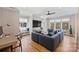 Comfortable living room with a large sectional sofa, hardwood floors, and built-in shelving at 2509 Montrose Ct, Charlotte, NC 28207