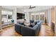 Cozy living room featuring a large sectional sofa, hardwood floors, and an entertainment center at 2509 Montrose Ct, Charlotte, NC 28207