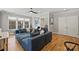 Spacious living room with a large sectional sofa, hardwood floors, and ample natural light at 2509 Montrose Ct, Charlotte, NC 28207
