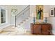 Elegant staircase with a modern railing, complemented by stylish decor and natural light at 2509 Montrose Ct, Charlotte, NC 28207