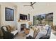 Cozy sunroom with a fireplace, ample natural light, and stylish furniture overlooking the landscaped backyard at 2509 Montrose Ct, Charlotte, NC 28207