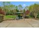 Beautiful backyard patio featuring an outdoor seating area perfect for entertaining at 2711 Liberty Hall Ct, Waxhaw, NC 28173