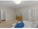 Spacious bedroom with neutral walls, plush carpet, and en suite bathroom for a private and relaxing space at 2711 Liberty Hall Ct, Waxhaw, NC 28173