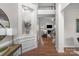 Grand foyer featuring hardwood floors, a staircase, and views of the living room with fireplace at 2711 Liberty Hall Ct, Waxhaw, NC 28173