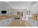 Open kitchen showcasing an island, modern appliances, and a view to the dining area at 2711 Liberty Hall Ct, Waxhaw, NC 28173
