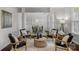 Open-concept living area with hardwood floors, decorative furniture, and seamless transition to the dining room at 2711 Liberty Hall Ct, Waxhaw, NC 28173