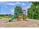 Colorful playground equipment surrounded by lush greenery offering a safe and fun recreational space at 2711 Liberty Hall Ct, Waxhaw, NC 28173
