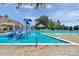 Community pool with splash pad area, lounge chairs, and pergola providing resort-style living at 2711 Liberty Hall Ct, Waxhaw, NC 28173