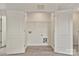 Spacious closet with washer-dryer hookups and wire shelving for organized storage at 2729 Yurman Rd, Charlotte, NC 28214