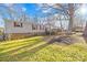 Charming home featuring a large yard, deck, and mature trees, perfect for outdoor entertaining at 334 Hillcrest Dr, Mooresville, NC 28115