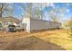 Exterior view of the home with a carport, backyard, and covered entry at 334 Hillcrest Dr, Mooresville, NC 28115
