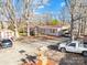 Exterior showcasing well-maintained home with red roof, carport, and surrounding greenery at 334 Hillcrest Dr, Mooresville, NC 28115