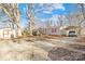 Exterior showcasing well-maintained home with red roof, carport, and surrounding greenery at 334 Hillcrest Dr, Mooresville, NC 28115