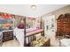 Charming bedroom with a four-poster bed, vintage furnishings, and soft lighting at 334 Hillcrest Dr, Mooresville, NC 28115