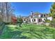 Expansive backyard with a putting green and a playset, perfect for outdoor fun at 4018 St Germaine Ln, Charlotte, NC 28210