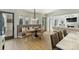 A dining area with a tufted bench seat, modern lighting and access to the outdoors at 4018 St Germaine Ln, Charlotte, NC 28210