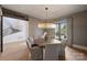 Chic dining room with round table, stylish chandelier, and views to the outside at 4018 St Germaine Ln, Charlotte, NC 28210