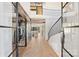 Spacious foyer boasts a glass-enclosed wine cellar and curved staircase with iron railings at 4018 St Germaine Ln, Charlotte, NC 28210