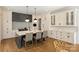 A modern kitchen featuring a spacious island with bar seating and a designer backsplash at 4018 St Germaine Ln, Charlotte, NC 28210