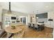 A spacious kitchen with an island, seamlessly connected to the living and dining areas at 4018 St Germaine Ln, Charlotte, NC 28210
