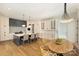 A modern kitchen with a large island, pendant lighting, white cabinets, and stainless steel appliances at 4018 St Germaine Ln, Charlotte, NC 28210