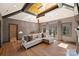 Cozy living room with hardwood floors, a fireplace, and plenty of natural light at 4018 St Germaine Ln, Charlotte, NC 28210