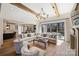 Open-concept living room flows into kitchen with an oversized sofa and ample natural light at 4018 St Germaine Ln, Charlotte, NC 28210