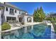 Spacious backyard featuring a large pool, sun loungers, and a well-maintained lawn at 4018 St Germaine Ln, Charlotte, NC 28210