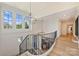 Bright entryway staircase featuring natural light and hardwood flooring at 4018 St Germaine Ln, Charlotte, NC 28210