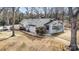 Beautifully landscaped property featuring a charming home with a deck, mature trees, and an expansive yard at 422 Lee Ave, Wadesboro, NC 28170