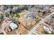 Aerial shot highlighting a large property with a well-manicured lawn, mature trees, and a charming home at 422 Lee Ave, Wadesboro, NC 28170